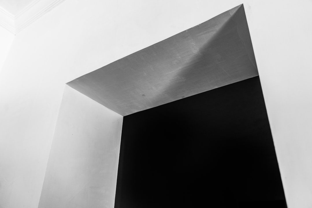 Abstract black and white geometric shapes, evoking systematic logical structure