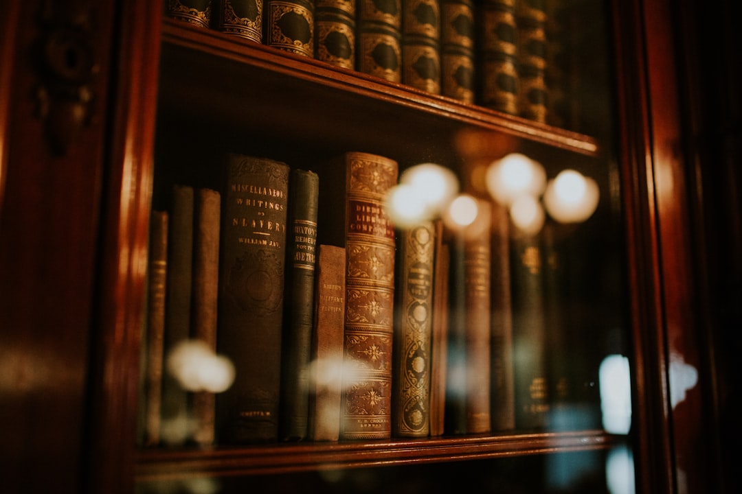 Shelf of antique leather-bound philosophy books