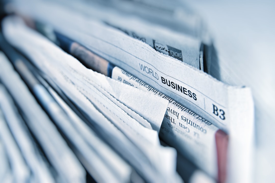 Stack of folded newspapers representing published articles