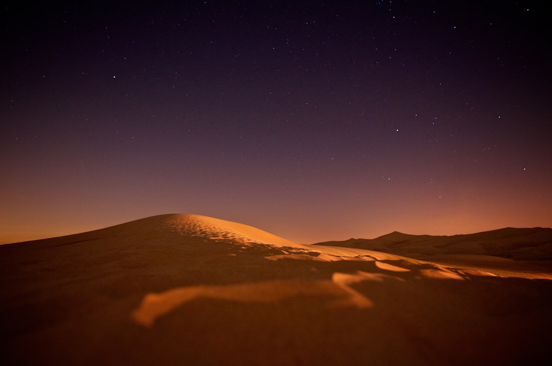 Stars over a desert dune at night, evoking Gilgamesh’s mythic journey